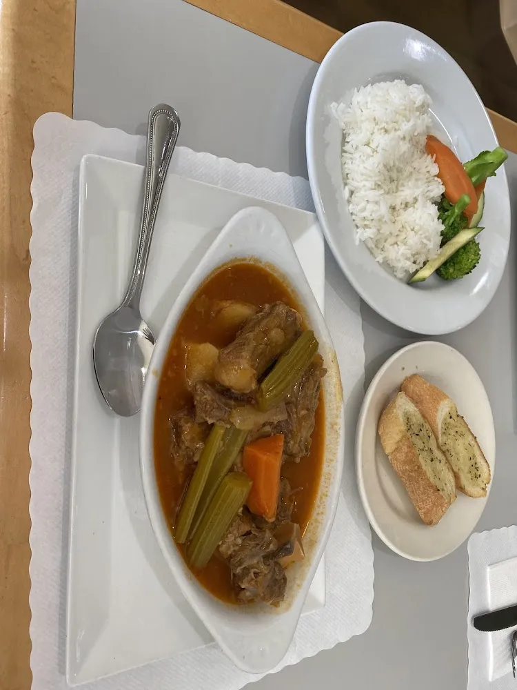 Oxtail Stew with Steam Vegetables Garlic Bread and Steam Rice